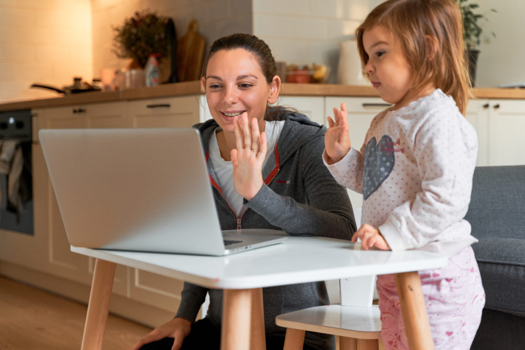 Mother and child at home. Video chat. Social distance.